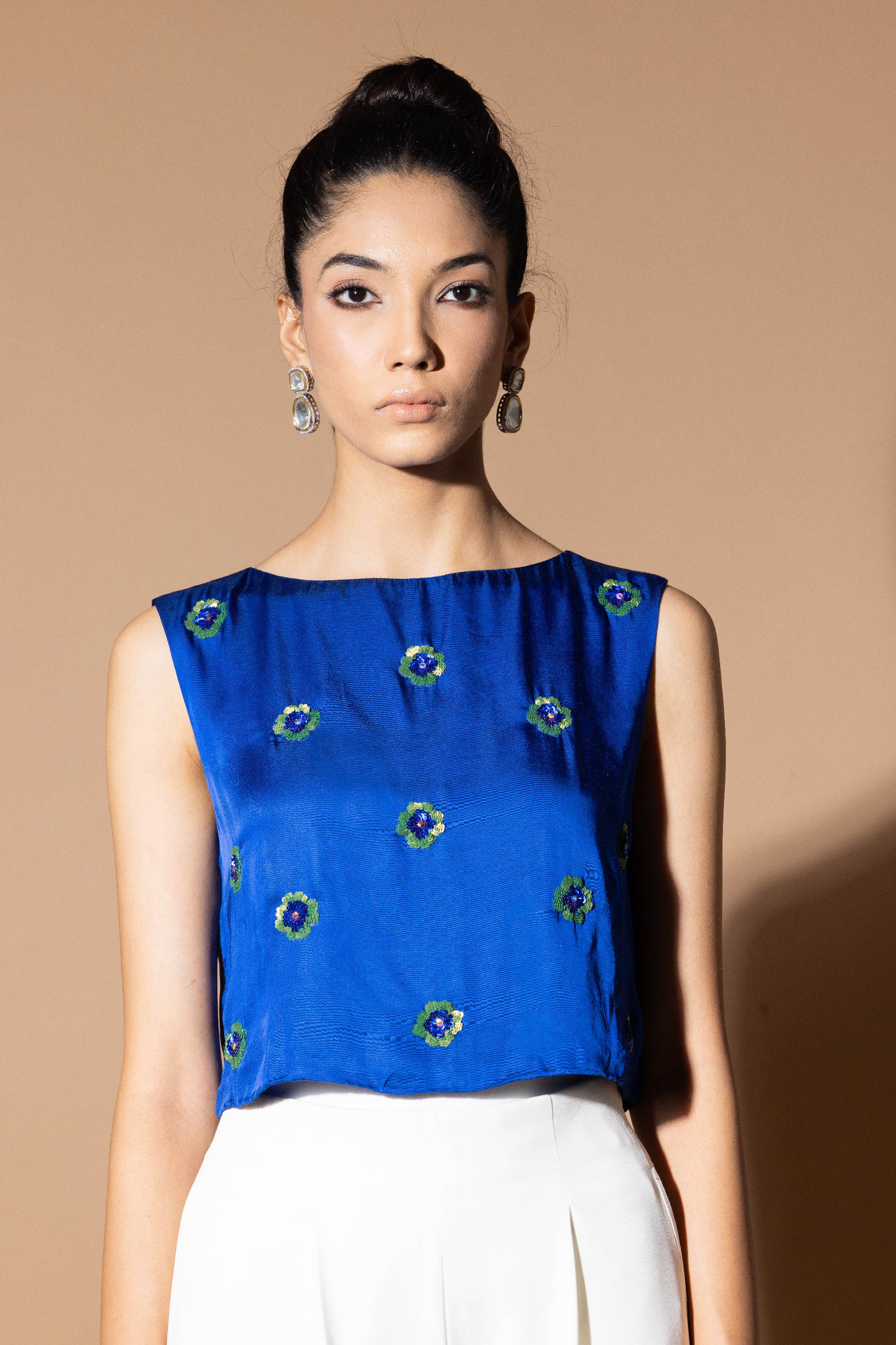 Celestial blue crop top with floral embellishment