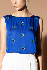 Celestial blue crop top with floral embellishment
